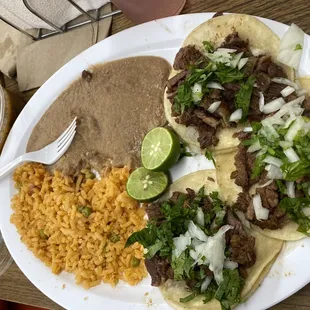 Carne Asada tacos with rice and beans