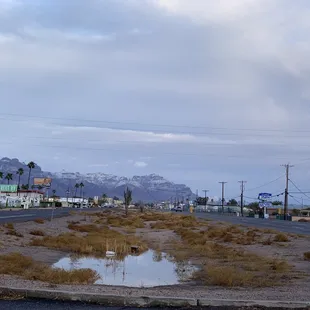 a puddle in the middle of the road