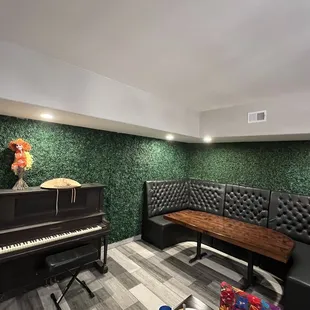 Inside area, a real piano.  Big tables for 6-8 persons