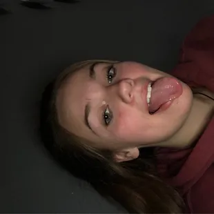 a woman with her tongue hanging out
