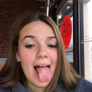 a woman sticking out her tongue