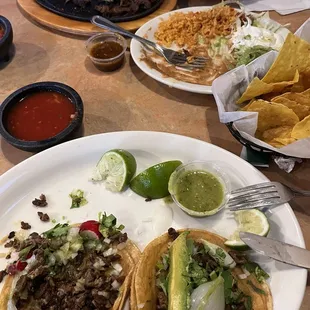 Carne Asada tacos, steak fajitas, chips, etc.  Pic taken halfway thru meal.