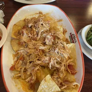 Chicken nachos with marinated chicken and cheese