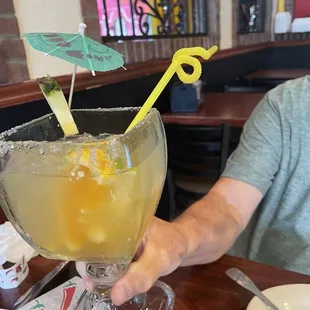 Margaritas with umbrella's, pineapple, orange, lime and lemon slices.