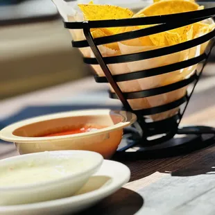 a basket of chips and salsa