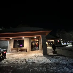 a car parked in front of a restaurant