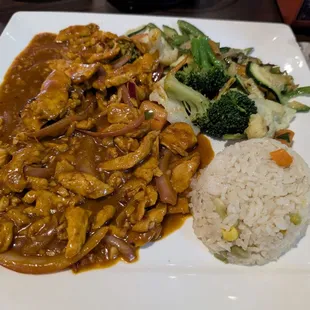 Pollo Kora - Grilled Chicken breast sauteed in Guajillo sauce, served with rice and vegetables.