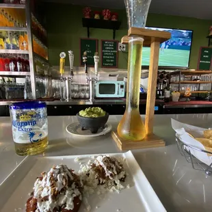 Platanos Rellenos (carnitas) and medium Guacamole