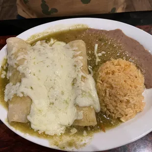 Enchiladas Suizas with a side of rice and refried beans