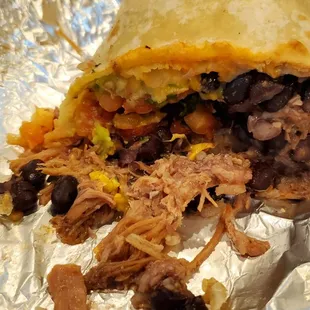 Super Burrito: beans, rice, cheese, guacamole, and salsa, Wrap Style, Carnitas (Fried Pork), no sour cream ($14.75)