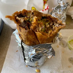 Chicken burrito with black beans and a tomato tortilla