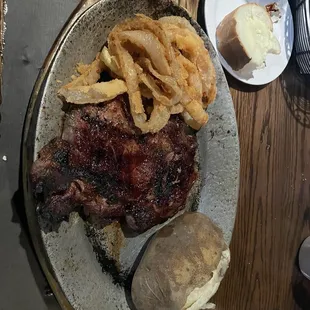 Ribeye, onion rings, baked potato