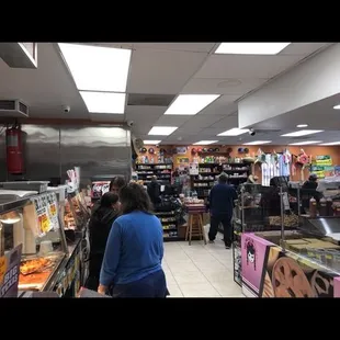 people shopping in a deli