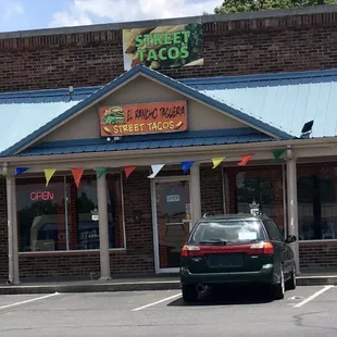 a car parked in front of the restaurant