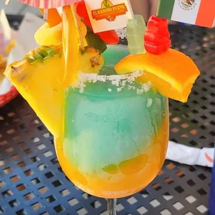 a colorful drink in a glass