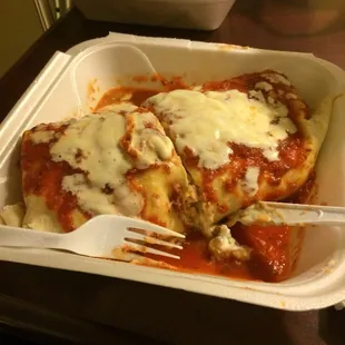 Big burrito with salsa and cheese on top one huge burrito pretty darn good