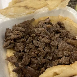a close up of a food item in a styrofoam container