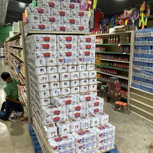 tacks of toilet paper on pallets