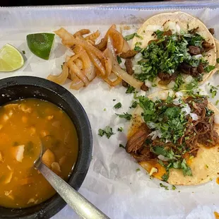 two tacos and a bowl of soup