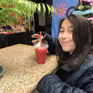 My daughter enjoying a strawberry raspado.