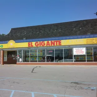 the front of a store in a parking lot