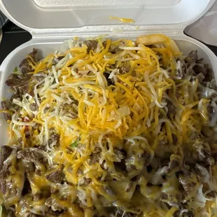 Carne asada fries not sure how I feel about the lettuce