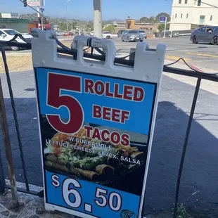 a sign for 5 beef tacos