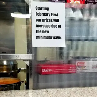 a sign on the counter of a fast food restaurant