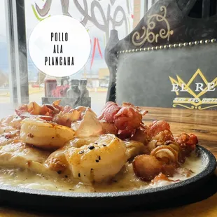 Pollo ala plancha/ Grilled chicken breast topped with bacon,shrimp and cheese sauce