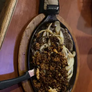 a skillet of food on a table