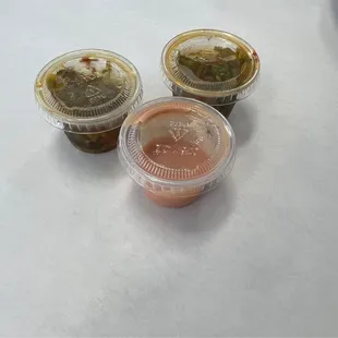 three take out containers of food