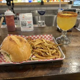 Fajita torta with fries and a margarita.