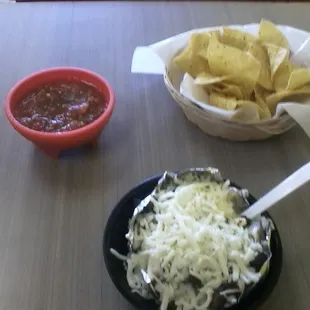 a bowl of chips and a bowl of salsa