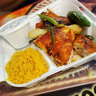 1/2 chicken with rice, beans, and onions