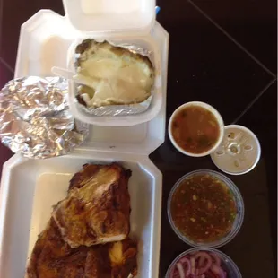 Medio pollo asado, $12. Come with corn tortillas, a papa asada (baked potato with cheese), salsa, onions, and frijoles charros