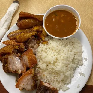 Rice beans ripe plantain and roasted pork
