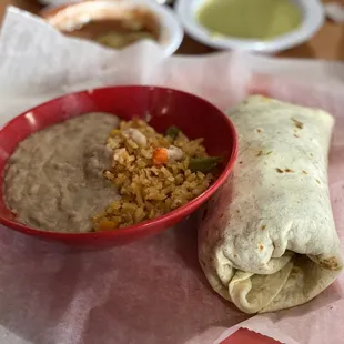 Steak burrito with rice and beans