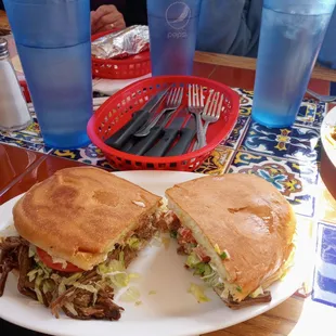 a cut in half sandwich on a plate