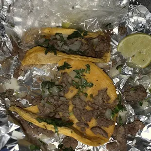 two tacos on tin foil