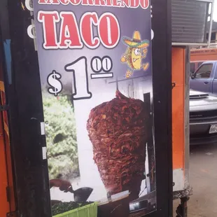 Another sign advertising $1 tacos at Tacorriendo