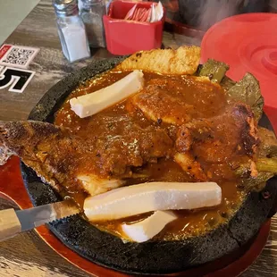 Chicken, asada, and shrimp molcajete.