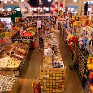 a grocery store filled with fruits and vegetables