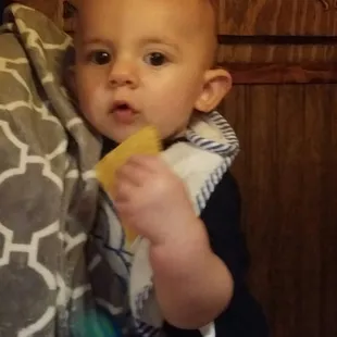 Little one demolishing some chips. And by demolish I mean sucking until it&apos;s soggy haha