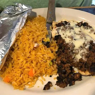 POLLO BAILARIN   Grilled chicken breast topped with    chorizo (mexican sausage) and cheese sauce. He said it was ok.