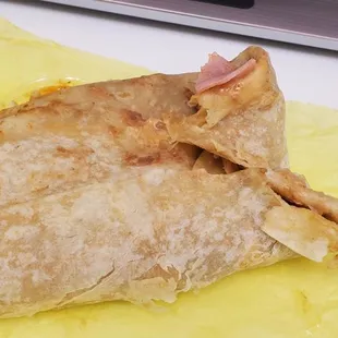 This is not how you fold a burrito. The flaps go inside, not outside.