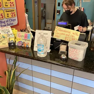 a woman behind the counter