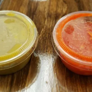 three condiments on a wooden table