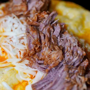 beef and cheese on a tortilla
