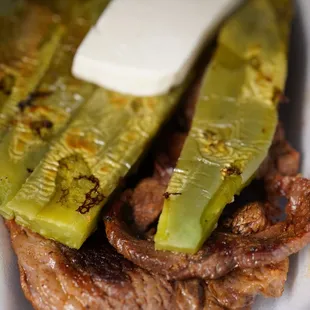steak with pickles and a pate of butter