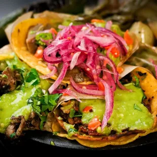 Tacos with pickled habanero red onion